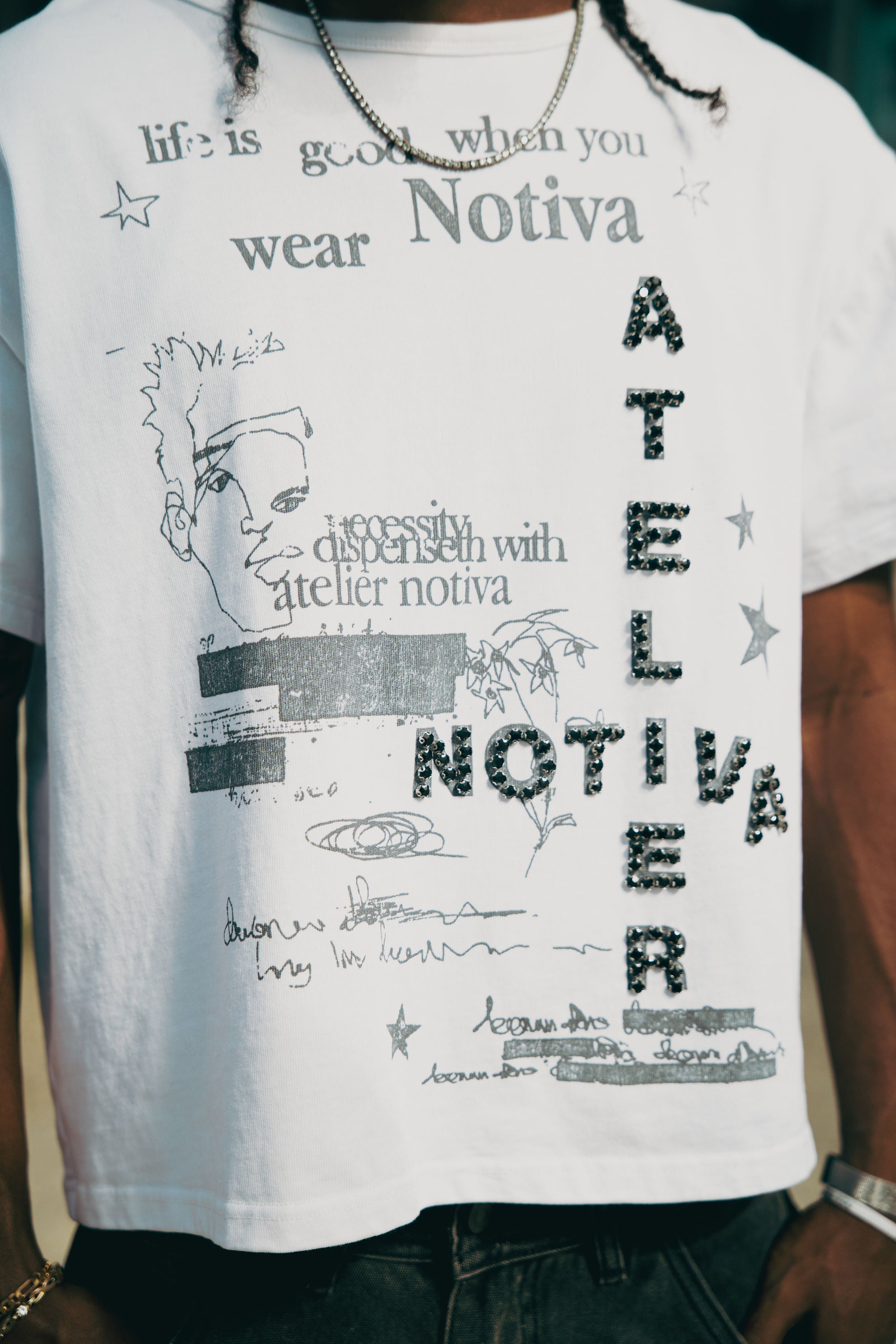 WHITE NEED GARMENTS TEE